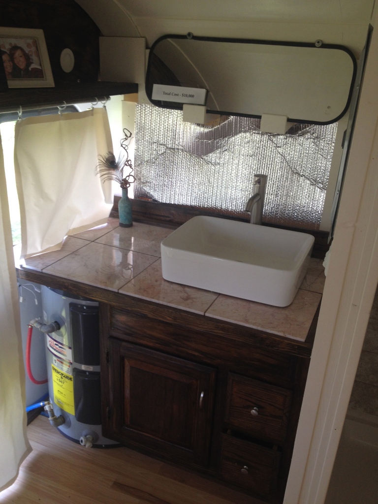 The vanity with fancy sink