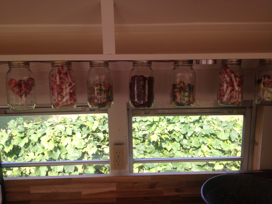 Over the butcher block counter, jars to store food